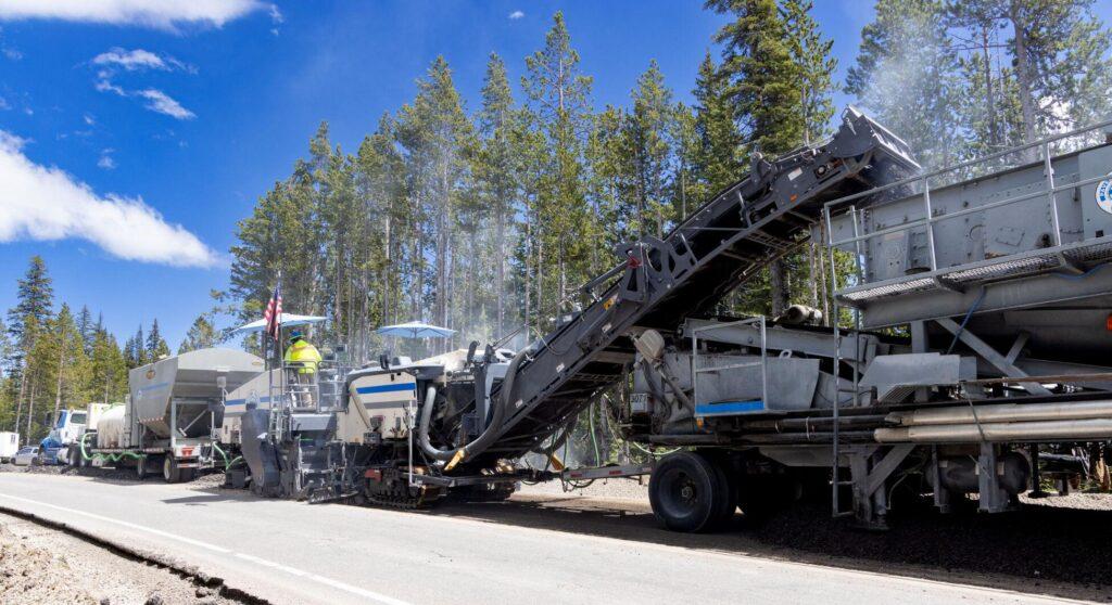 Old asphalt is removed in preparation for road work between Old Faithful and West Thumb in 2023.